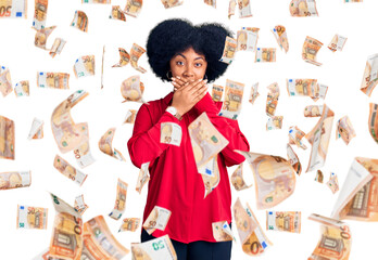 Sticker - Young african american girl wearing casual clothes shocked covering mouth with hands for mistake. secret concept.