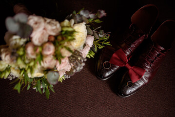 Wedding accessories of the groom on a brown background