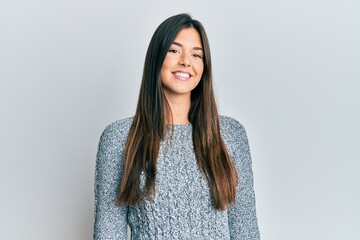 Poster - Young brunette woman wearing casual winter sweater with a happy and cool smile on face. lucky person.