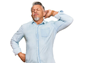 Poster - Middle age grey-haired man wearing casual clothes suffering of neck ache injury, touching neck with hand, muscular pain