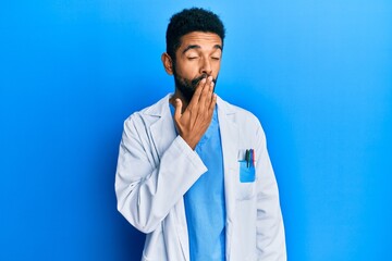 Canvas Print - Handsome hispanic man with beard wearing doctor uniform bored yawning tired covering mouth with hand. restless and sleepiness.