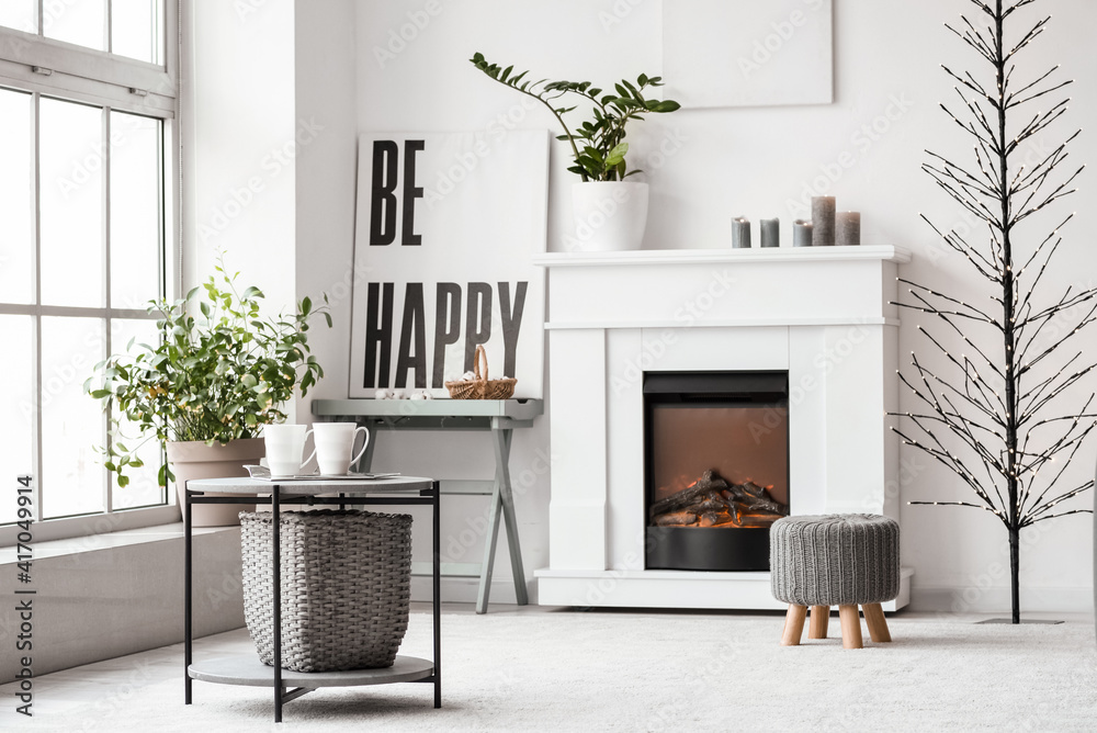 Stylish interior of living room with fireplace