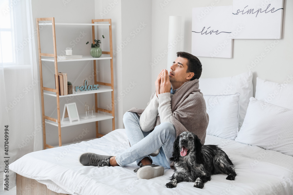 Sick man with his dog at home