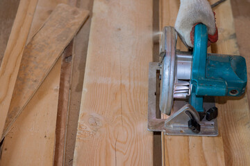 Cutting plywood using an electrical chain saw professional tools