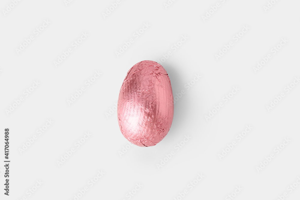 Sweet chocolate egg on white background
