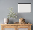 © kite_rin - Blank picture frame mockup on gray wall. Scandinavian living room design. View of modern style interior. Home staging and minimalism concept