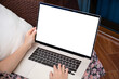 © DenPhoto - female hands on laptop computer keyboard with isolated screen