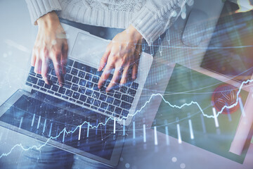 Aufkleber - Double exposure of woman hands working on computer and forex chart hologram drawing. Top View. Financial analysis concept.