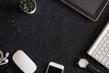 Poster - top view of office desk table with  calculator, notebook, plastic plant, smartphone and keyboard, graphic designer, Creative Designer concept.