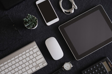 Poster - top view of office desk table with  calculator, notebook, plastic plant, smartphone and keyboard, graphic designer, Creative Designer concept.