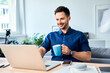 © baranq - Happy man working at home, drinking coffee