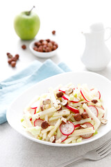 Wall Mural - Fresh fruit and vegetable salad with kohlrabi, green apple, radish and hazelnuts