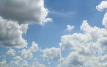 Light Bright Blue Sky With Fluffy White Towering Clouds - Replacement Or Background.