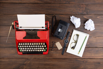 Wall Mural - Journalism or blogging concept vintage typewriter on the wooden desk, top view