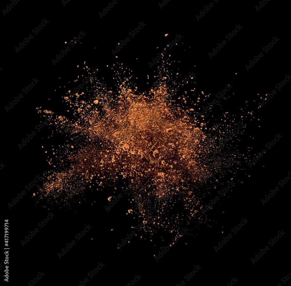 Cocoa powder explosion on black background - obrazy, fototapety, plakaty 