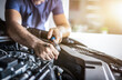 © REDPIXEL - Auto mechanic working and repair on car engine in mechanics garage. Car service.