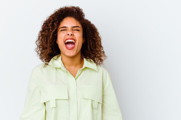 Wall Mural - Young african american woman isolated on white background shouting very angry, rage concept, frustrated.