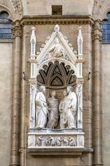 Wall Mural - The statues of Four Crowned Martyrs by Nanni di Banco in a niche of the Church Orsanmichele in via dei Calzaiuoli, built in the 14th century, Florence city center, Tuscany, Italy