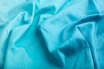 fragment of cotton blue tissue. side view, natural textile background.
