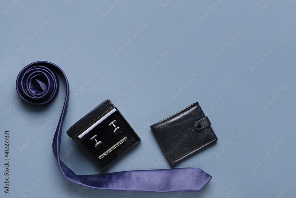 Stylish male accessories on grey background