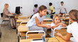 © JackF - Group of smiling kids pupils of elementary school chatting in break between lessons