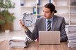 © Elnur - Young male employee in time management concept