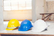 © aFotostock - Construction hard hat safety tools equipment for workers in construction site for engineering protection head standard. Many hard hat helmet on row with copy space. Engineering Construction Concept