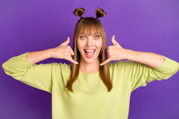 Sticker - Photo of sweet adorable young lady wear green sweater showing telephone gestures isolated violet color background