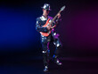 © rotozey - a male artist in a mirrored suit and hat with an electric guitar on a dark background