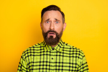 Poster - Portrait of attractive miserable unlucky devastated man wearing checked shirt isolated over bright yellow color background