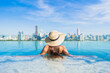 © siraphol - Portrait beautiful young asian woman smile relax leisure around outdoor swimming pool