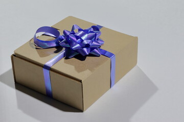 Gift wrap made of paper with a blue ribbon.