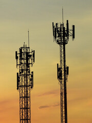 telecommunication tower antenna silhouette with beautiful sky background at sunset