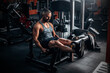 © VlaDee - Muscular man using weights machine for legs at the gym
