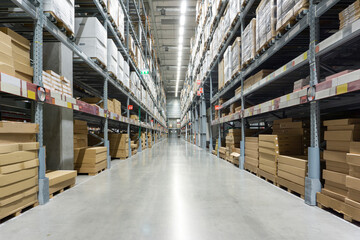 Inventory. Rows of shelves with boxes. Factory warehouse storage.