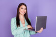 © deagreez - Photo of charming young businesswoman hold hands computer work freelancer isolated on purple color background