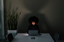 Businesswoman Working In Dark Office