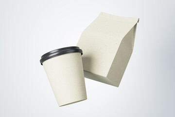 Poster - Blank white paper cup to go and white coffee package in the air at light background. Mock up