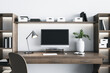 © Who is Danny - Eco style wooden home workplace with modern computer monitor with blank black screen, white vase, steel lamp and white wall on background. Mockup