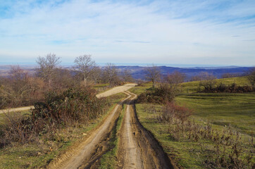 Scenic empty dirt road. Merger of two roads in rural. Nature and travel. Russia, North Caucasus, Dagestan, Tabasaransky District