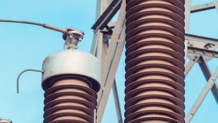 Close up of Insulators on a high voltage tower