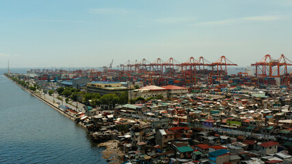 Wall Mural - Sea port with container terminal in the city of Manila. Largest cargo port. modern harbor and global trade background ,Philippines.