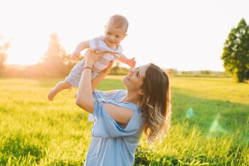 mom and son enjoying summer in the park relation concept caucasian Front or Back Yard play together sun