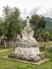 Wall Mural - bhuddist stupa at the roadside on a small road in bhutan