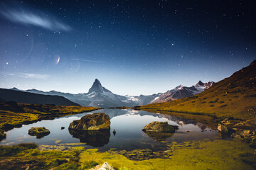 Wall Mural - famous peak matterhorn (cervino) under the starry sky. location place stellisee, switzerland, swiss 