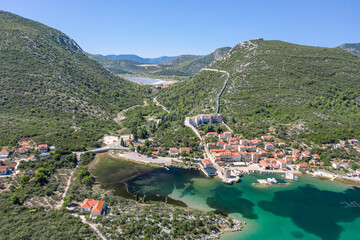 Wall Mural - Aerial drone shot of Mali Ston village with City Wall of Ston in Ragusa near Dubrovnik in Croatia summer