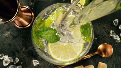 Poster - Pouring soda into mojito cocktail