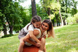 © iordani - young pretty mother walking with little cute daughter outside in green park, lifestyle poeple concept