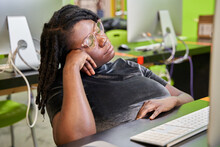 Black Female College Student Tired And Exhausted In Computer Lab