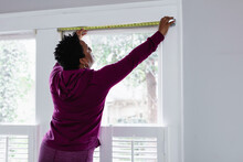 DIY, Woman Uses Tape Measure Tool On Window